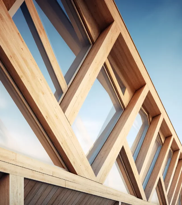 Vue en contre-plongée d’une structure bois moderne avec façade vitrée – services Agrandissimmo Pro